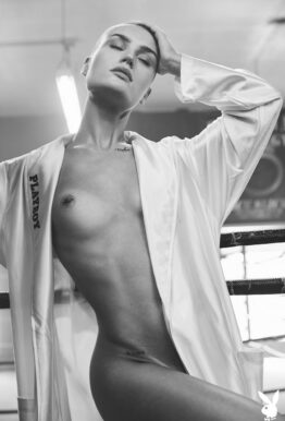 Photos of bald fit model Vendela in boxing gear and exercising naked in the ring